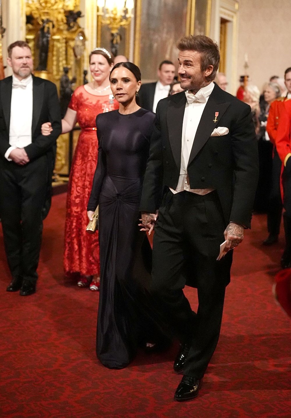 Victoria ve David Beckham Buckingham Sarayı'nda