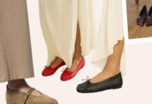 Close-up of feet wearing red ballet flats, black woven flats, and beige trousers in a fashion display.