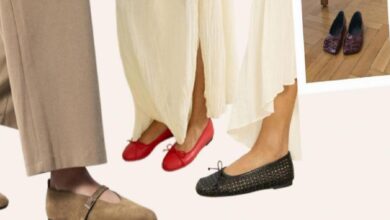 Close-up of feet wearing red ballet flats, black woven flats, and beige trousers in a fashion display.
