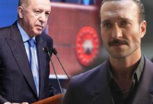 Turkish President Erdoğan speaks at a podium with microphones; a man with a mustache stands in the foreground.